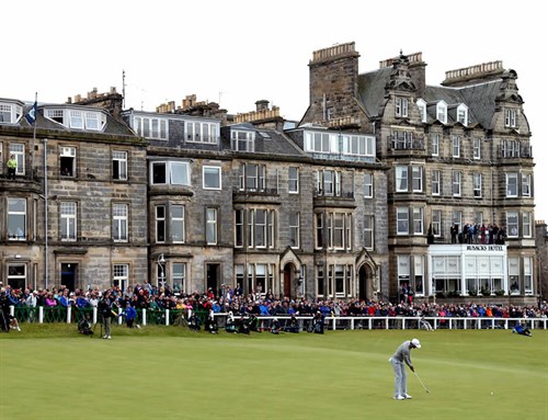 Golfer Putting In Front Of St Andrews